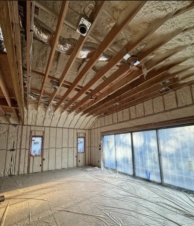 Interior walls and ceiling insulated with spray foam during new construction in Oakville
